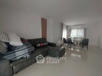 Spacious living room with modern furniture and dining area
