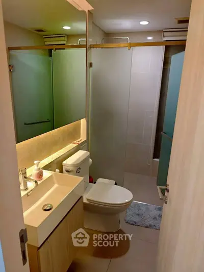 Modern bathroom with sleek fixtures and ambient lighting