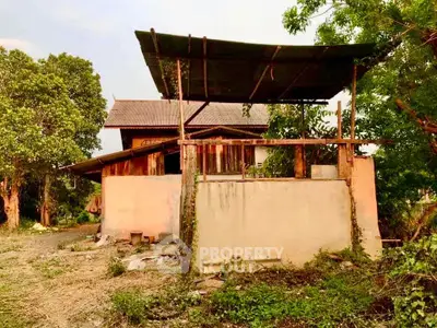 Charming rustic property surrounded by lush greenery, ideal for renovation or development opportunities.