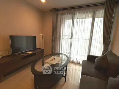 Cozy living room with modern furniture and large window for natural light