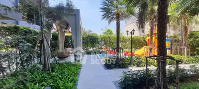 Luxurious garden area with playground and seating, perfect for family relaxation.