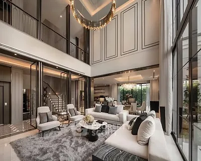 Luxurious double-height living room with elegant decor and large windows