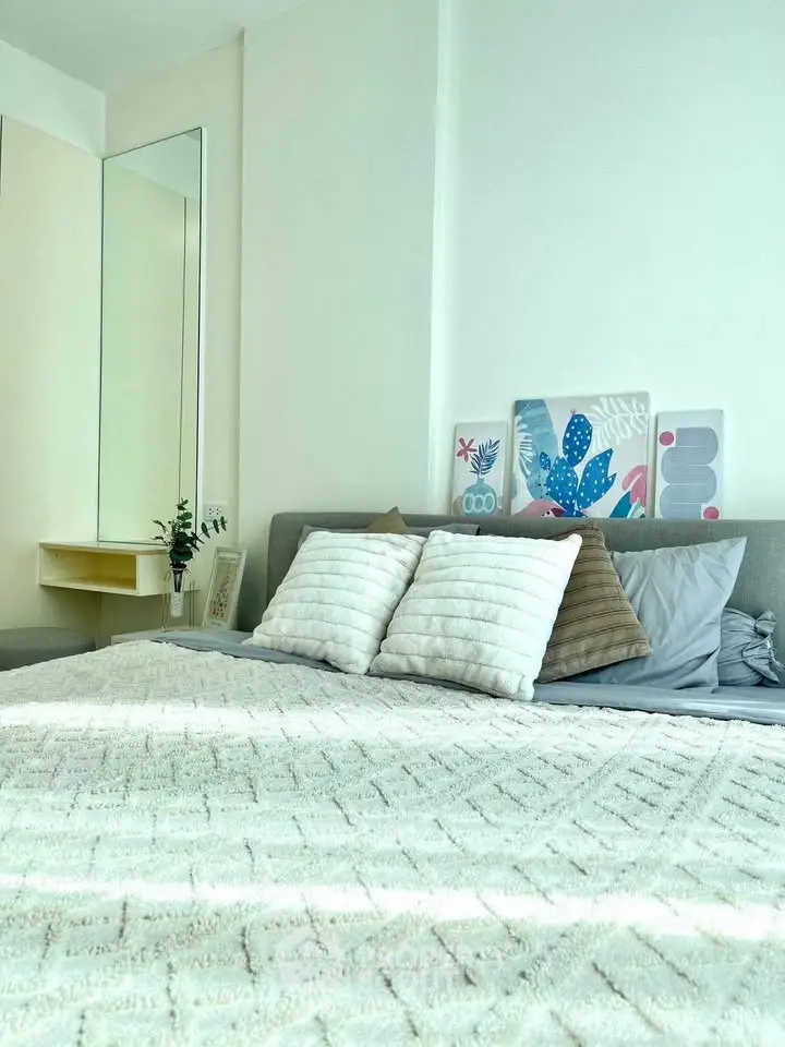 Bright and cozy bedroom with modern decor and plush bedding