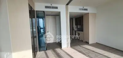 Spacious modern apartment interior with open layout and wooden flooring