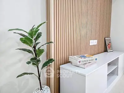 Modern interior with stylish wooden paneling and sleek white shelving unit, perfect for contemporary living spaces.