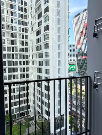 Modern urban balcony with cityscape view, perfect for enjoying vibrant city life.