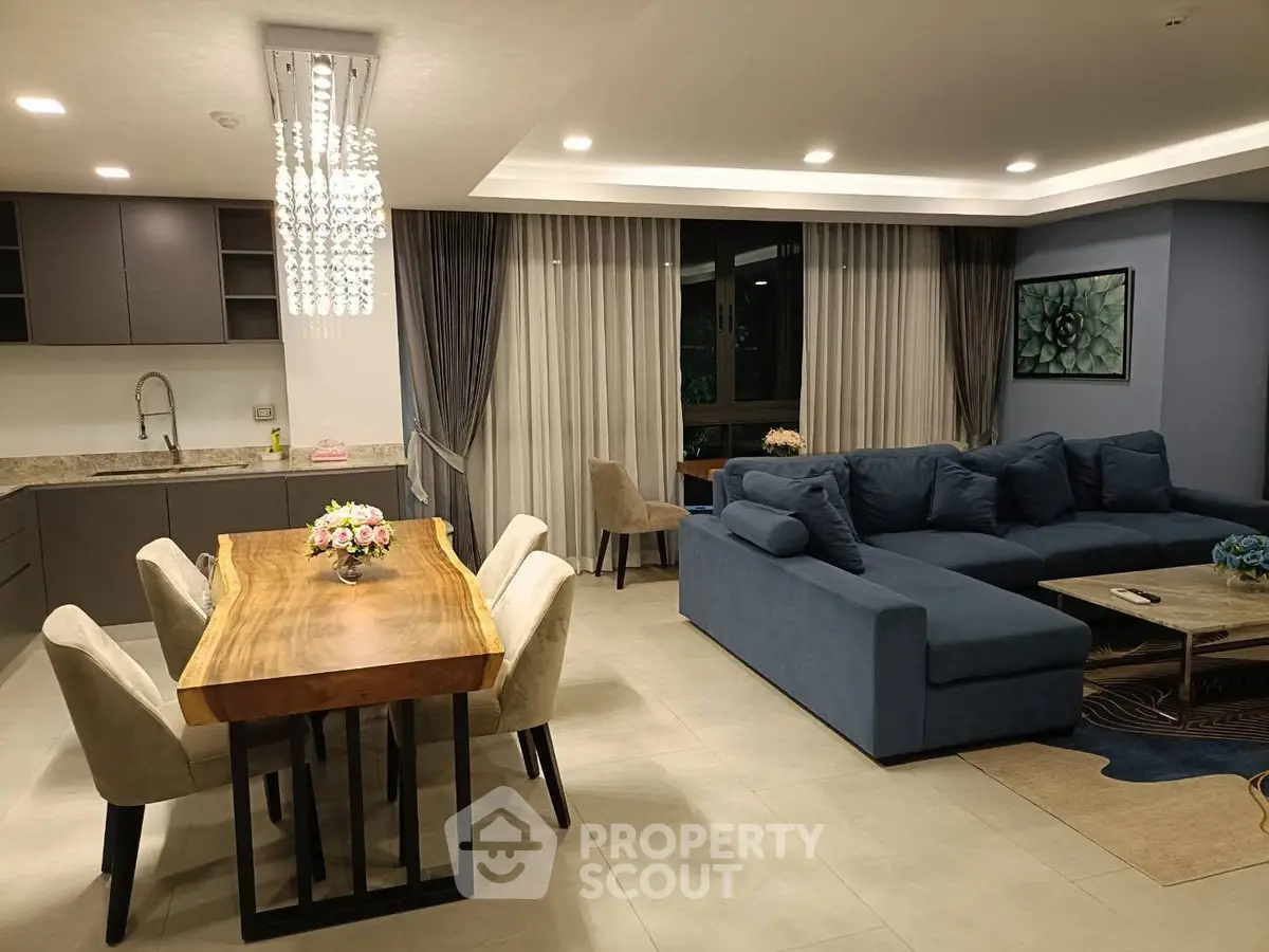 Luxurious open-plan living room with modern kitchen and elegant dining area