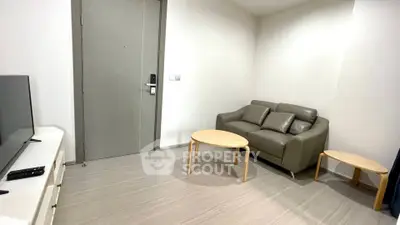 Modern living room with sleek furniture and neutral tones, perfect for cozy relaxation.