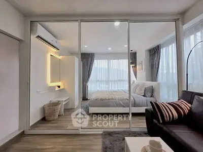 Modern bedroom with mirrored closet and cozy decor