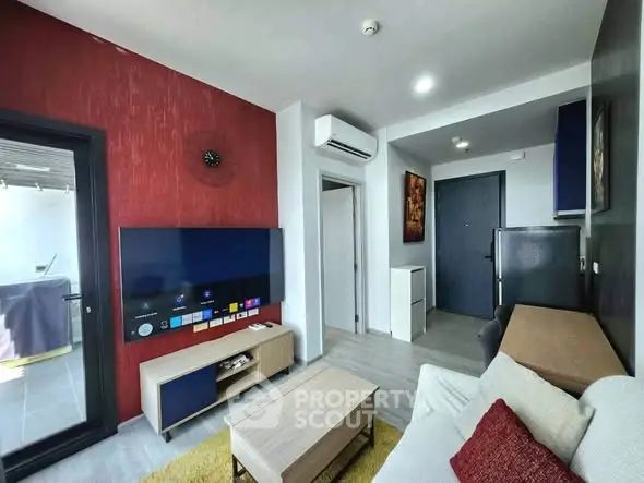 Modern living room with stylish decor and balcony access