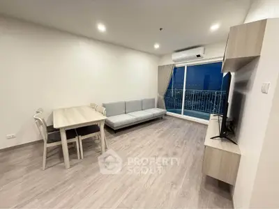 Modern living room with sleek furniture and balcony view