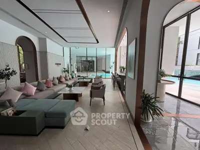 Luxurious modern living room with pool view and elegant decor