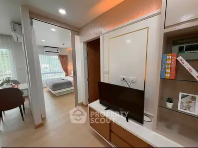 Modern apartment interior with open living area and cozy bedroom view