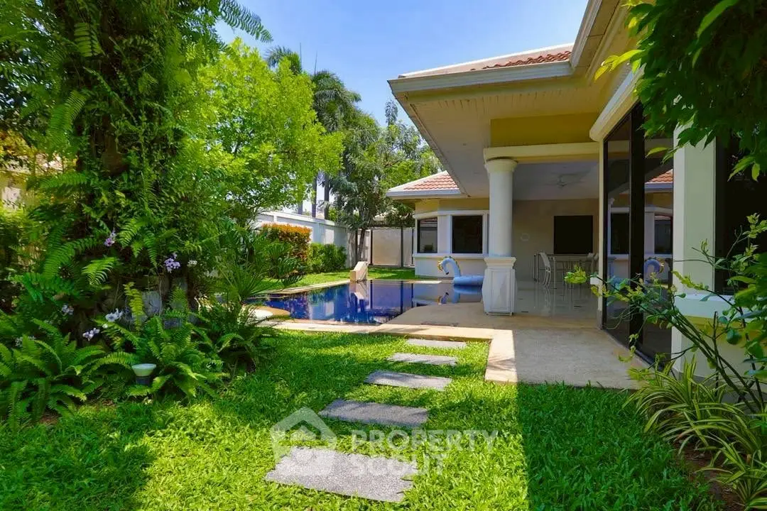 Luxurious villa with lush garden and private pool, perfect for serene living.