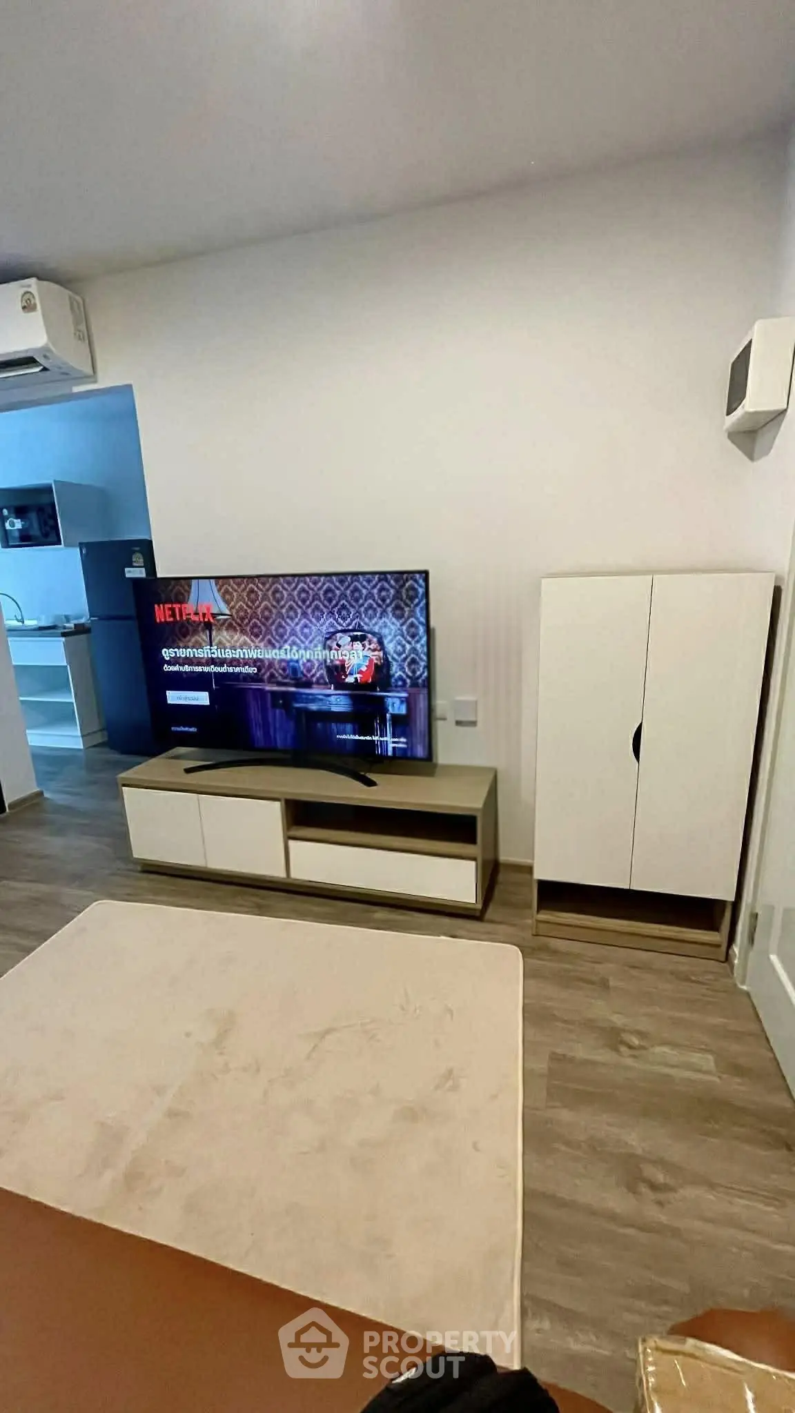 Modern living room with stylish TV setup and sleek furniture