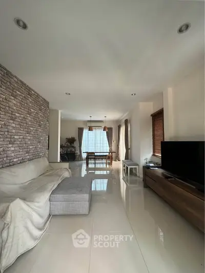 Spacious modern living room with sleek design and natural light