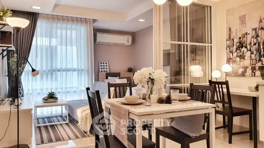 Stylish modern living and dining area with elegant decor and natural light.