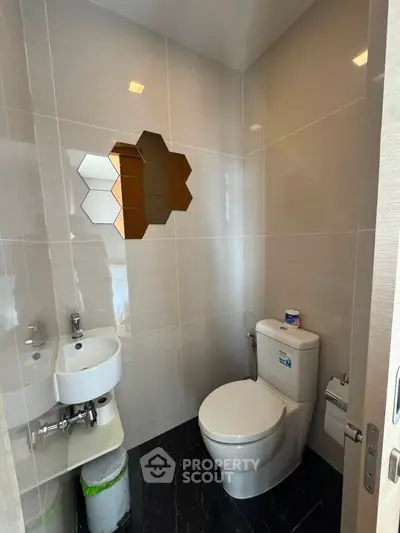 Modern bathroom with sleek tiles and stylish mirror design