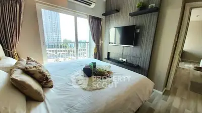 Modern bedroom with balcony view in high-rise apartment