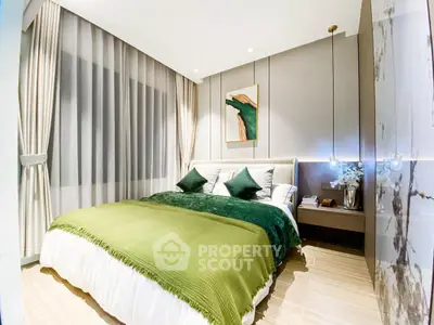 Luxurious modern bedroom with elegant decor and green accents, perfect for relaxation and comfort.