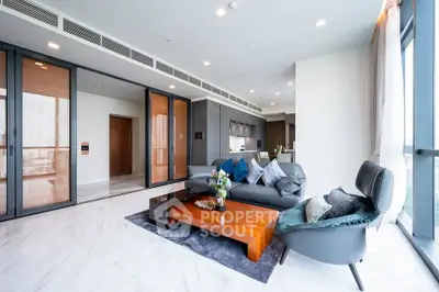 Luxurious modern living room with elegant furniture and open kitchen layout