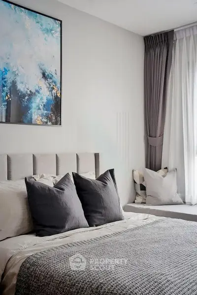 Modern bedroom with stylish decor and natural light