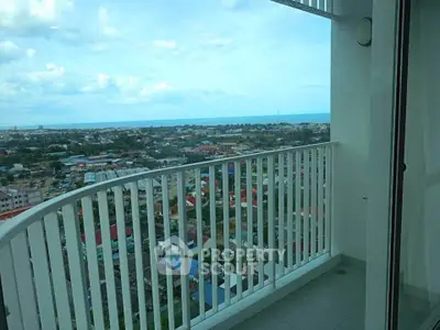Stunning balcony with panoramic city view in modern high-rise apartment.