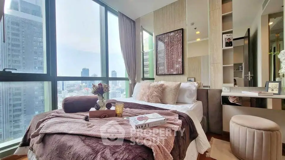 Luxurious bedroom with stunning city view and elegant decor in high-rise apartment.