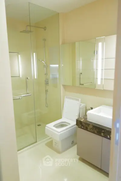 Modern bathroom with glass shower and sleek fixtures