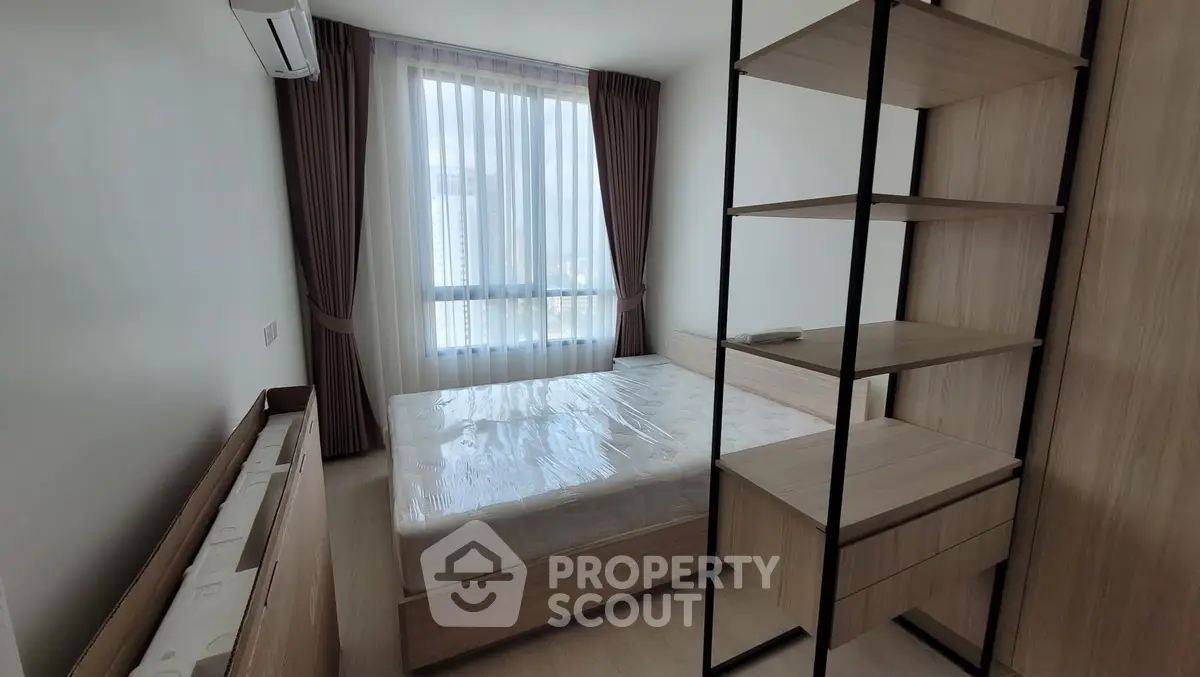 Modern bedroom with natural light and stylish wooden furniture