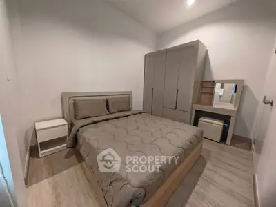 Modern bedroom with stylish furniture and cozy ambiance