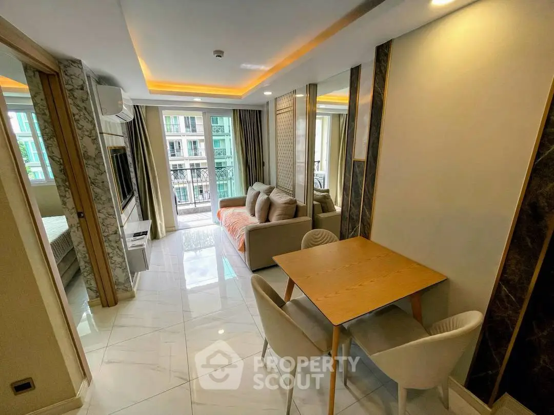 Modern living room with elegant decor and balcony view in a stylish apartment.