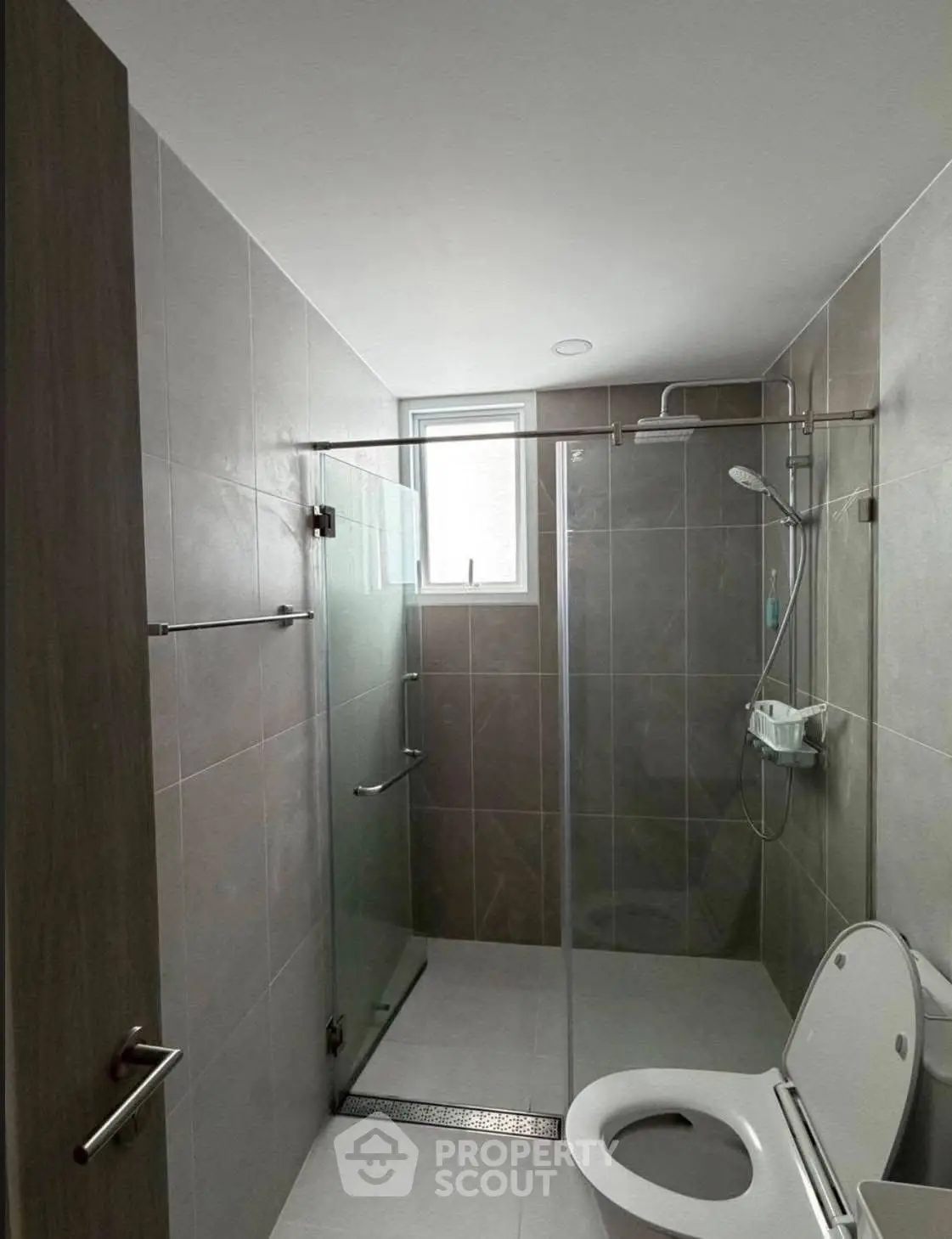 Modern bathroom with glass shower enclosure and sleek tile design