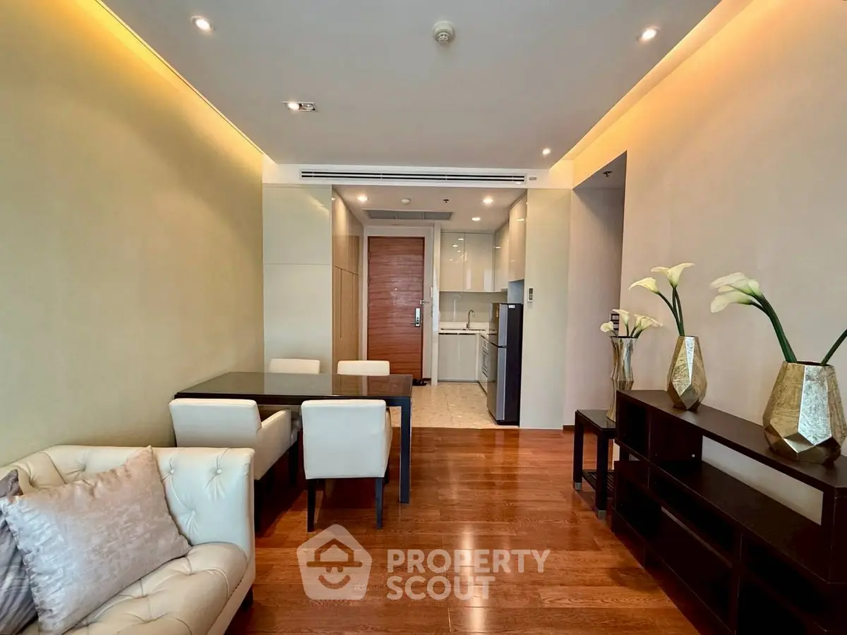 Modern living room with elegant dining area and open kitchen layout