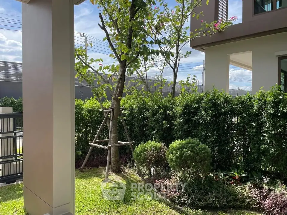 Charming garden view with lush greenery and modern architecture