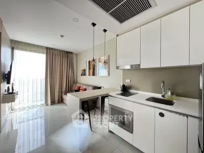 Modern open-layout kitchen with sleek design and cozy living area, perfect for urban living.