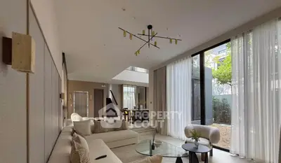 Luxurious modern living room with floor-to-ceiling windows and elegant decor