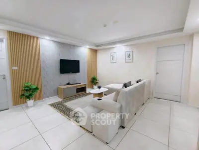 Modern living room with stylish decor and comfortable seating in a contemporary apartment.