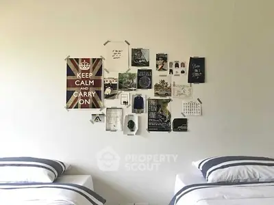 Chic bedroom with twin beds and stylish wall decor for modern living.