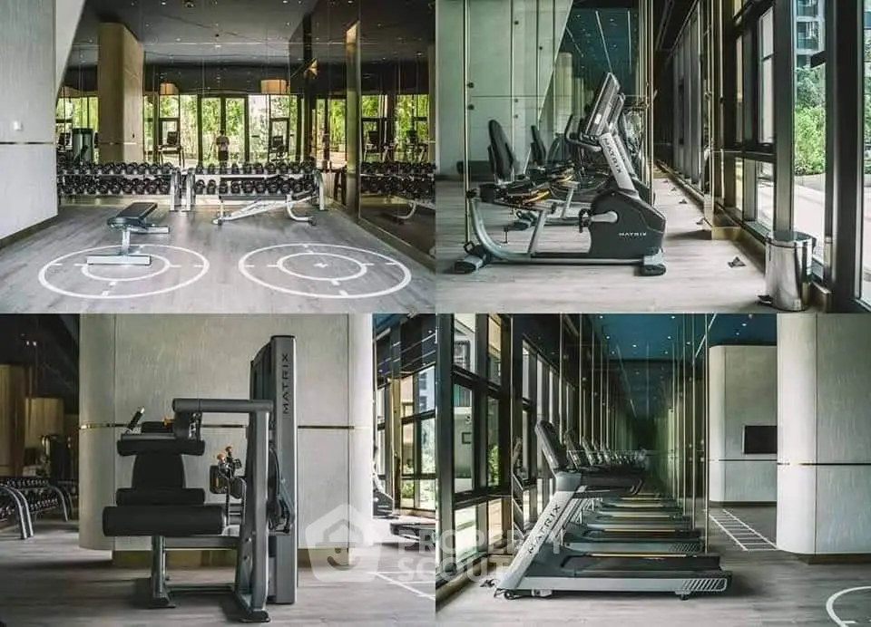 Luxurious gym with modern equipment and floor-to-ceiling windows in upscale residential building.