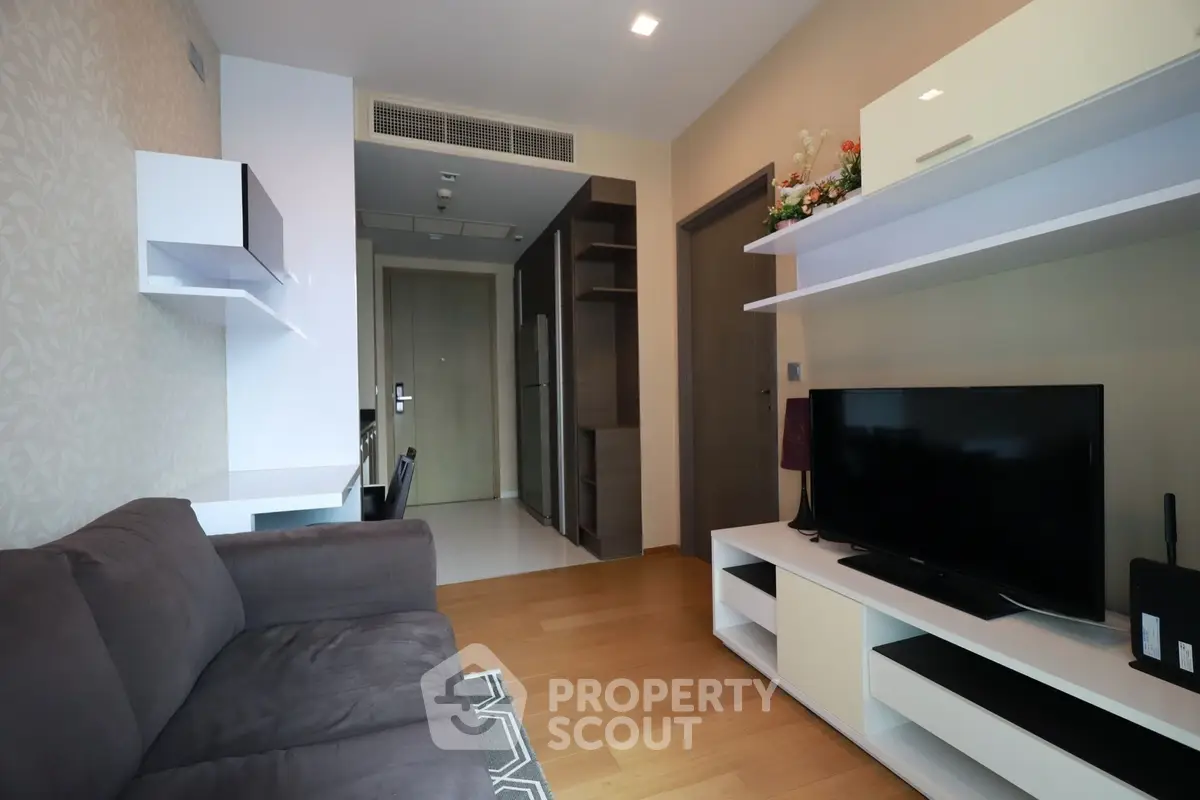 Modern living room with sleek furniture and entertainment center