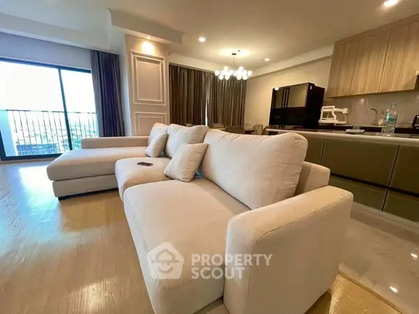 Spacious modern living room with open kitchen and elegant decor
