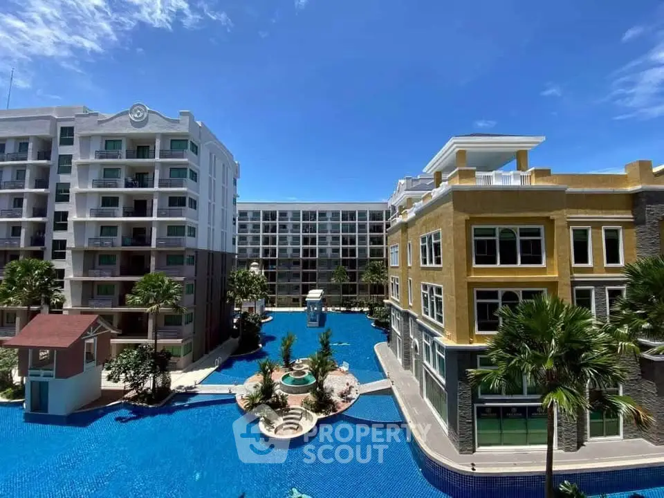 Luxurious apartment complex with stunning pool view and modern architecture.