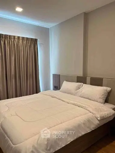 Cozy and inviting bedroom with a large comfortable bed, crisp white bedding, and elegant neutral tones, perfect for restful nights in a modern home.