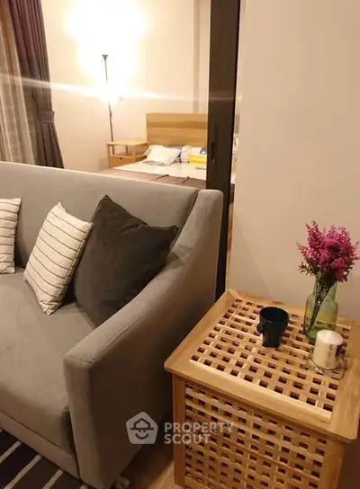 Cozy living room with stylish sofa and wooden side table, perfect for modern living.