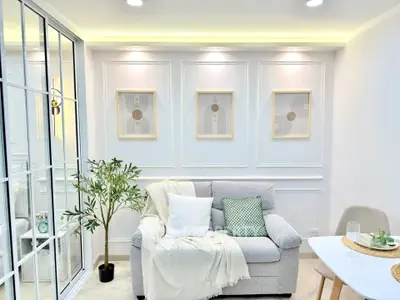Chic modern living room with elegant decor and cozy seating, perfect for relaxation and entertaining.