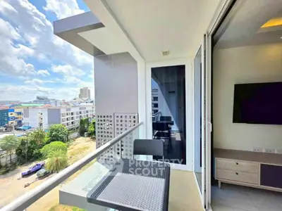 Modern balcony with city view and stylish furniture in urban apartment