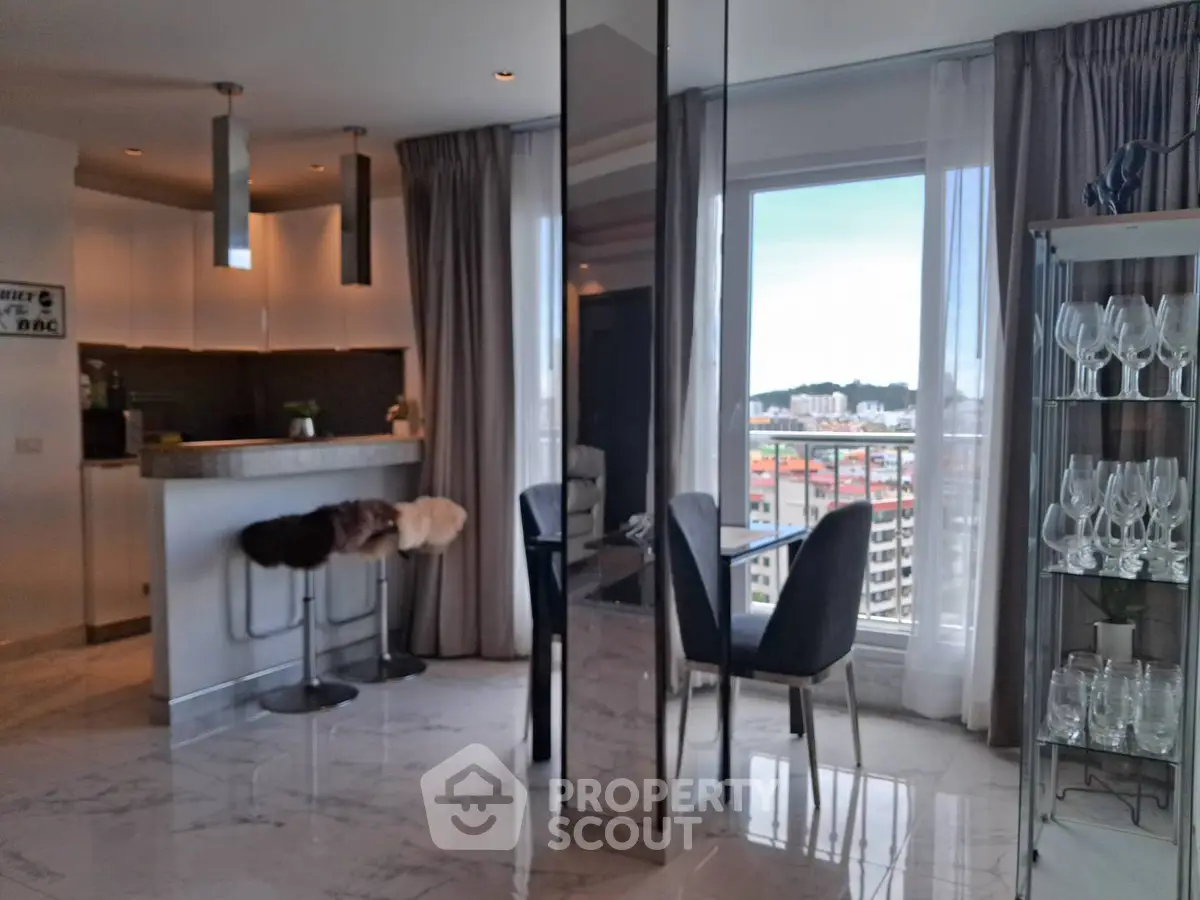 Luxurious modern living room with city view, sleek kitchen, and elegant dining area.