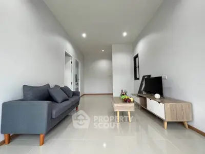 Modern living room with sleek furniture and minimalist decor, perfect for contemporary living.