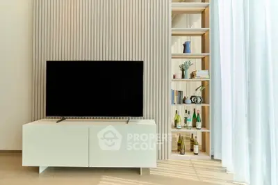 Modern living room with sleek TV stand and stylish shelving, perfect for contemporary living.